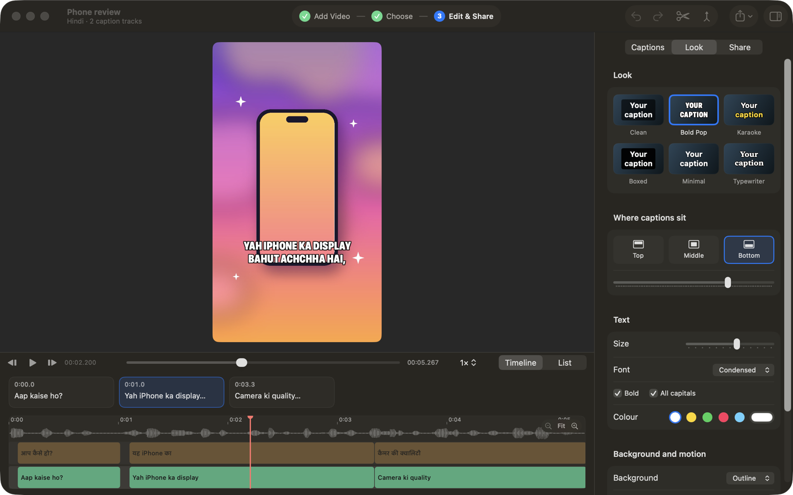 The Subly editor in dark mode. A colourful vertical video shows the bold caption “Yah iPhone ka display bahut achchha hai”, with Hindi and Hinglish caption tracks lined up on the timeline and caption looks in the side panel.